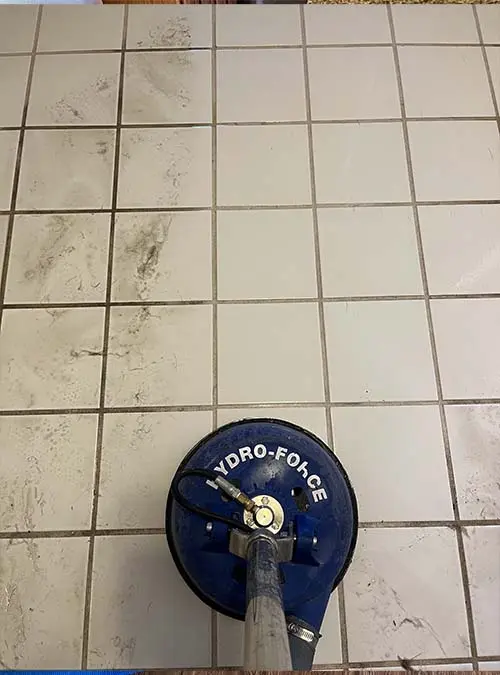 Dirty white tile getting professional tile cleaning from Willing & Able Carpet Cleaning