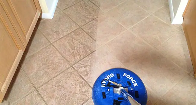 Tile Cleaning Like Magic Showing a tile floor getting cleaned with grout